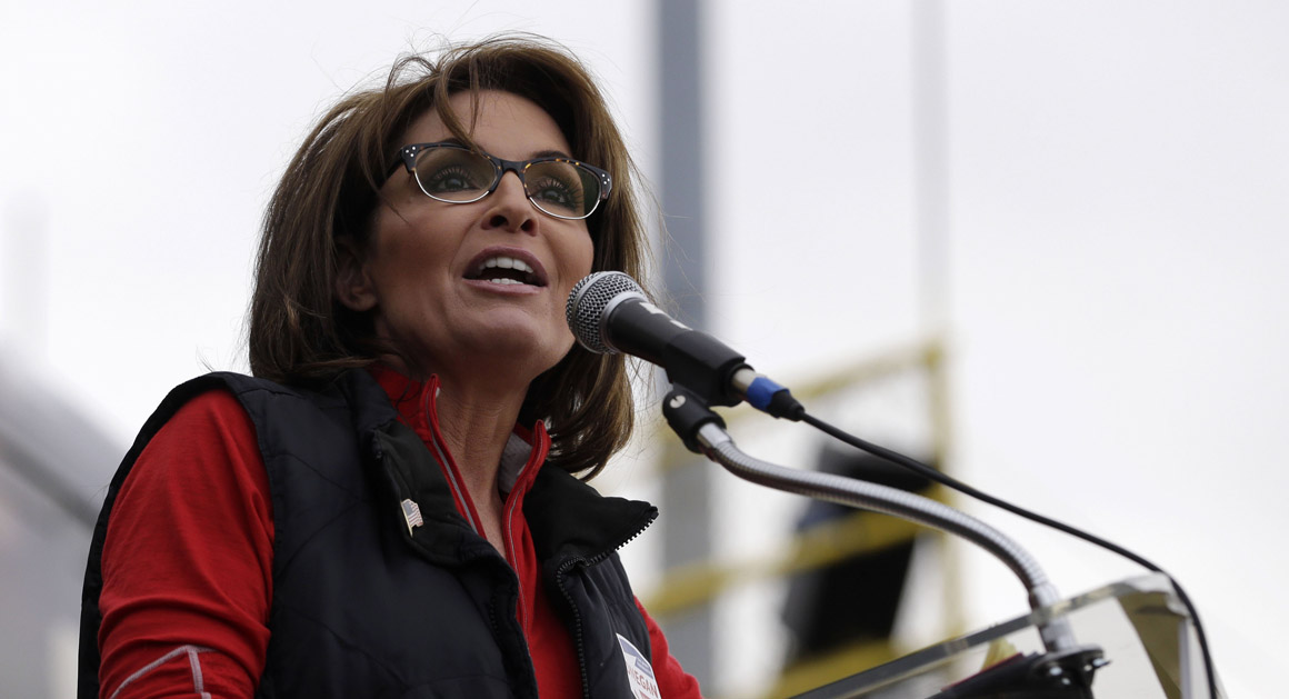 Former Alaska Gov. Sarah Palin talks during a rally supporting Steve Lonegan, left, who is running for the vacant New Jersey seat in the U.S. Senate, Saturday, Oct. 12, 2013, in New Egypt, N.J. Palin has said Lonegan